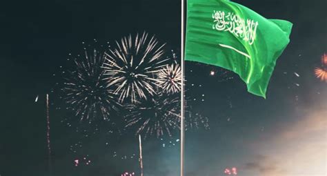 Fireworks in the sky of Saudi Arabia at night, the Saudi national flag ...