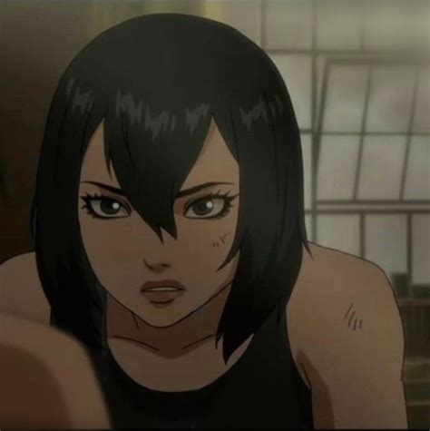 an animated image of a woman with black hair and green eyes looking at the camera