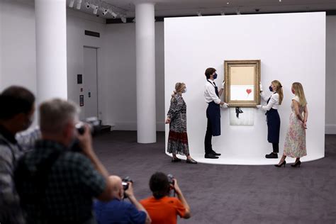 Three years on, shredded Banksy artwork returns to auction | Reuters