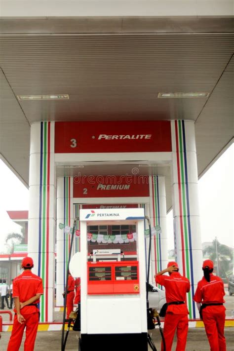 Operator Pertamina Gas Station Serving Buyers by Filling Pertalite Editorial Photo - Image of ...