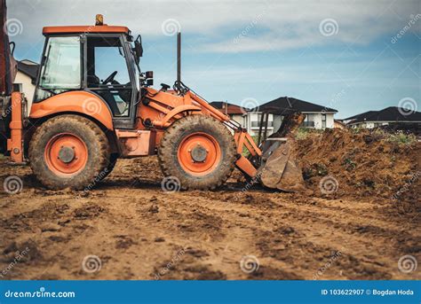 Industrial Machinery at Construction Site. Backhoe Loader Working Stock ...