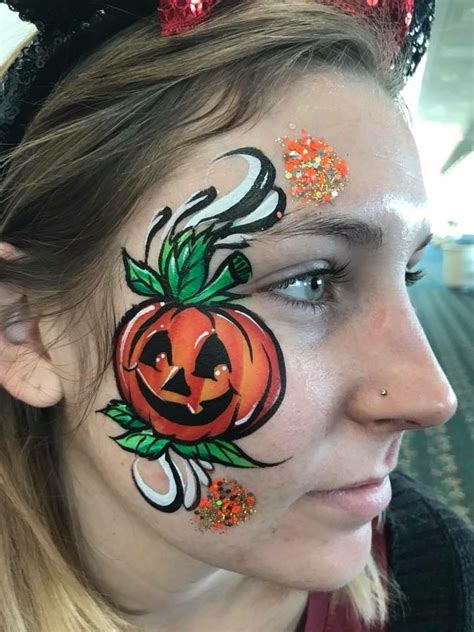 Pumpkin face painting | Face painting halloween, Pumpkin face paint ...