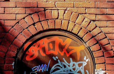 Graffiti and Red Brick Wall Photograph by Robert Ullmann | Pixels