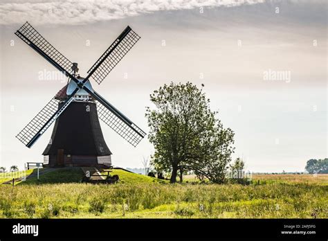 Windmill Wynhamster Kolk near the town of Leer, East Frisia, Lower Saxony, Germany Stock Photo ...