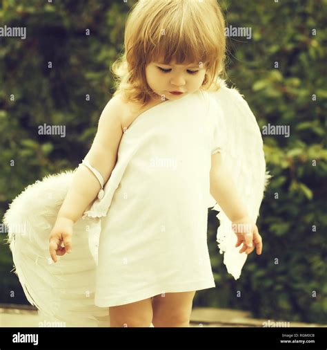 small boy in angel wings Stock Photo - Alamy