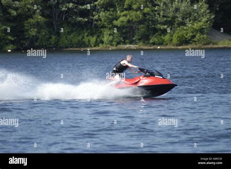 Man going fast on Jet Ski Stock Photo - Alamy