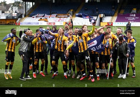 Cambridge United players celebrate on the pitch after the Sky Bet ...