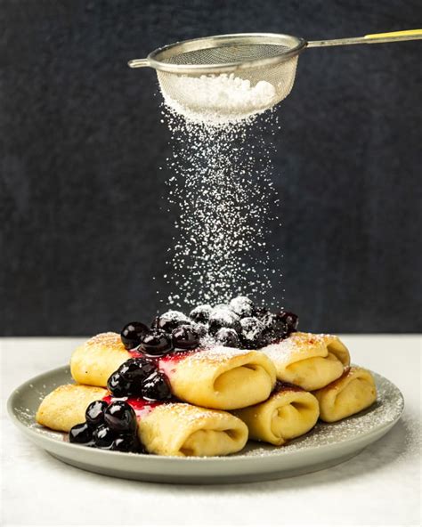 Cheese Blintz Recipe (Traditional Pan-Fried Version with Blueberry Compote) | The Kitchn