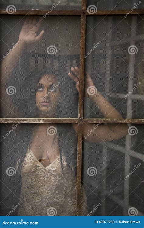 Young Indian Woman Gazing Out Old Screen Door Royalty-Free Stock Image | CartoonDealer.com #49071250