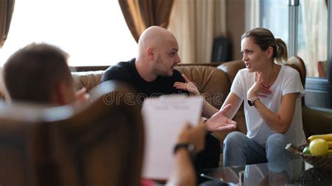 Young Married Couple of Man and Woman Talk To Psychologist at Therapy Session Stock Photo ...