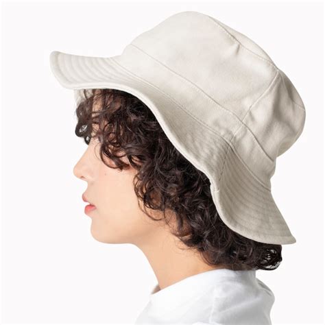 Free Photo | Beautiful woman in white bucket hat fashion studio shoot