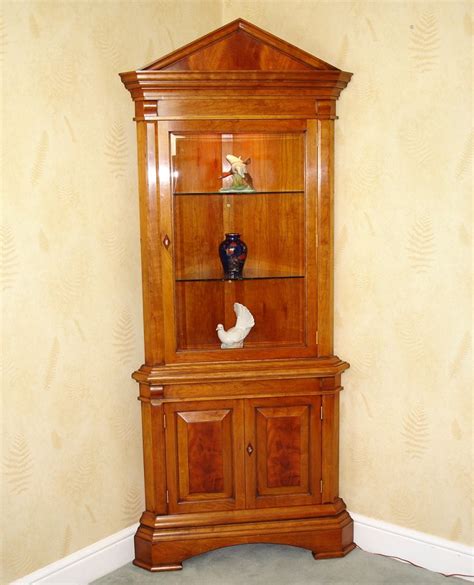 Open Front Cherry Wood Corner Cabinet An open front double door corner cabinet, two glass ...