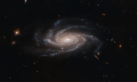 Hubble Space Telescope Spots Ghostly Spiral With Open Arms