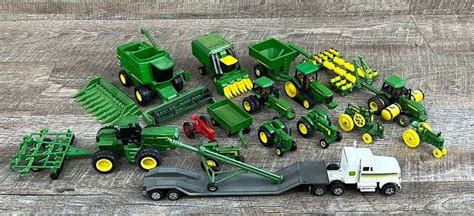 Group of 1/64 John Deere farm toys - Schneider Auctioneers LLC