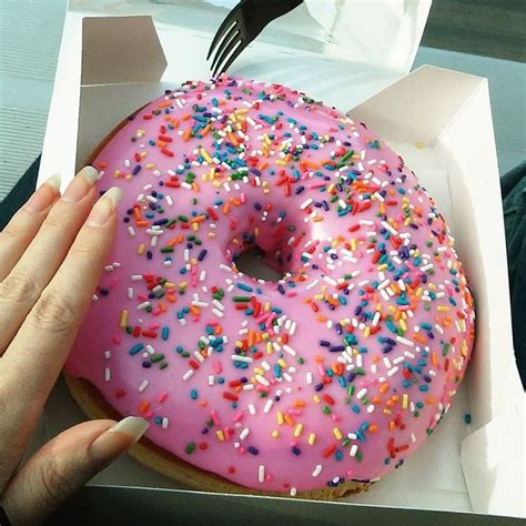 Tara on Instagram: “Lard Lad's Big Pink Donut from Springfield at Universal Studios. Hands shown ...