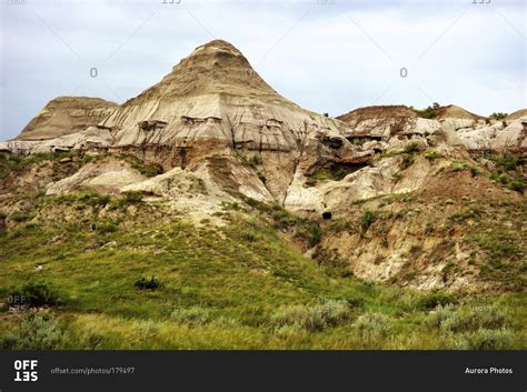 The evening light shines on the badlands at Dinosaur Provincial Park in ...