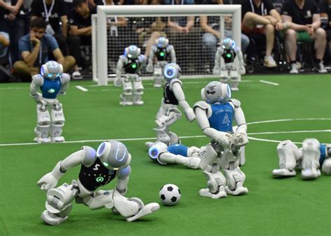 Robot soccer tournament displays robots mediocre soccer skills.