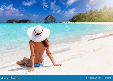 Woman Sits on a Tropical Paradise Beach in the Maldives Islands Stock Photo - Image of beach ...