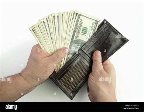 Opening the wallet full of money Stock Photo - Alamy