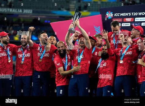 England players celebrate with the winners trophy after their win ...