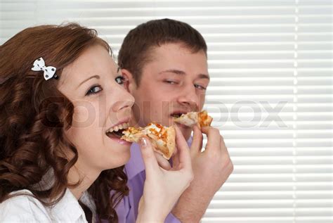 Lovely people eat the pizza | Stock image | Colourbox