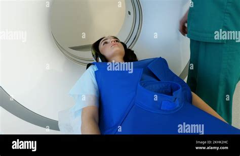 Radiologist controls CT or MRI or PET scan with patient undergoing ...