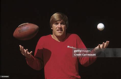 Closeup portrait of Stanford QB John Elway with football and... News ...