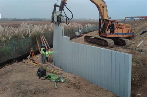 Retaining Wall for FAA Project | Steel & Concrete Inside Vinyl Pile