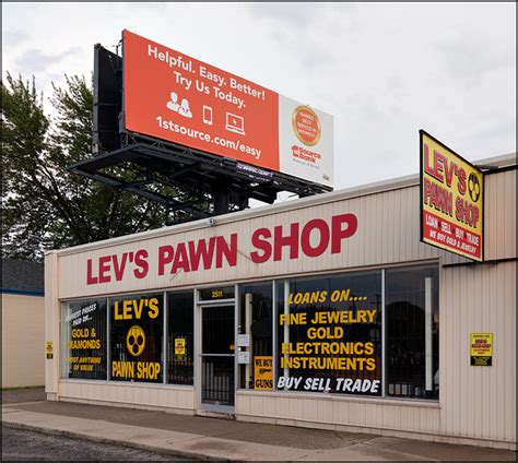 Banking for rich and poor | Bank billboard above a pawn shop ...