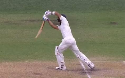 Virat Kohli plays a glorious cover drive off Mitchell Starc