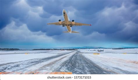 Snow On The Runway With Airplane