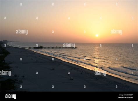 Sunrise on South Carolina Beach with pier Stock Photo - Alamy