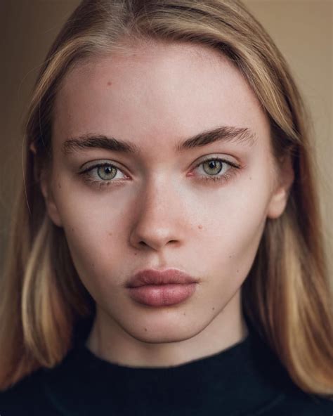 Portrait of a Woman with Blonde Hair and Blue Eyes