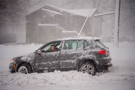 Car stuck in snow? Try these 5 tips before you get out and push | Driving