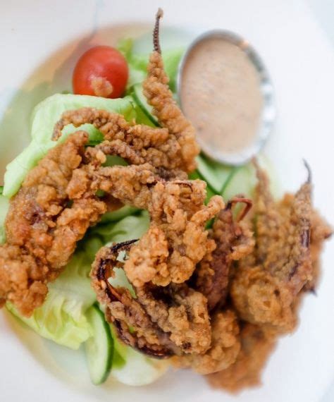 Crispy-fried squid heads with salad and sesame dressing at Eight ...