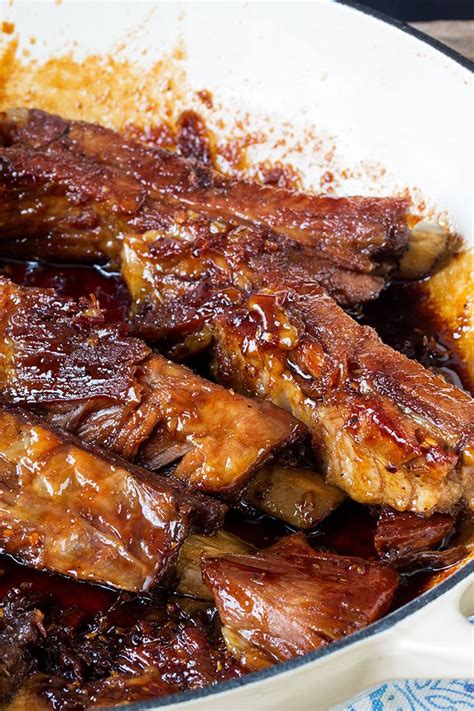 Fall apart pork ribs with a golden crispy exterior, covered in a sweet ...