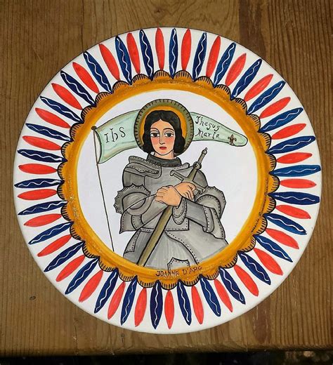 a plate with an image of a woman holding a flag