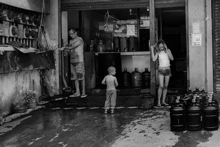 Water distribution | Father and his two children outside of … | Flickr