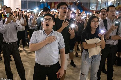 Hong Kong demonstrators belt out unofficial national anthem during face ...