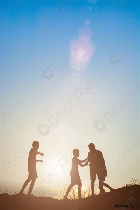 Silhouette of children playing in the park sunset time - stock photo 1104496 | Crushpixel