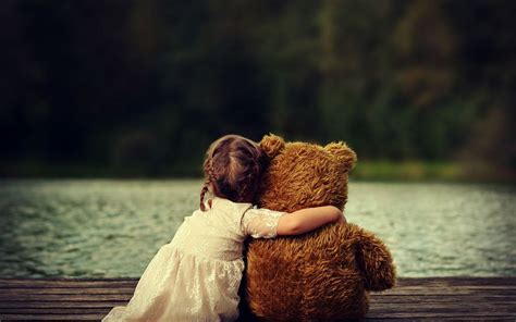 Cute Baby Girl With Teddy Bear Wallpaper