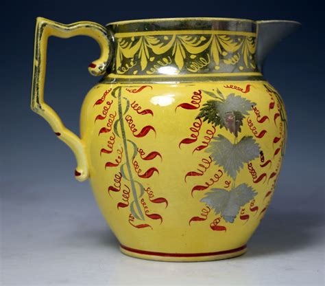 English pottery antique pitcher with canary yellow ground and silver ...