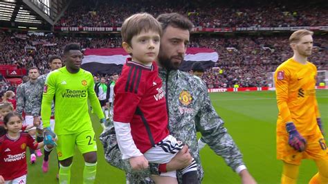 Heartwarming moment Bruno Fernandes carries young Man Utd mascot who ...