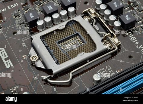 Intel LGA1155 processor socket on an ASUS motherboard Stock Photo - Alamy