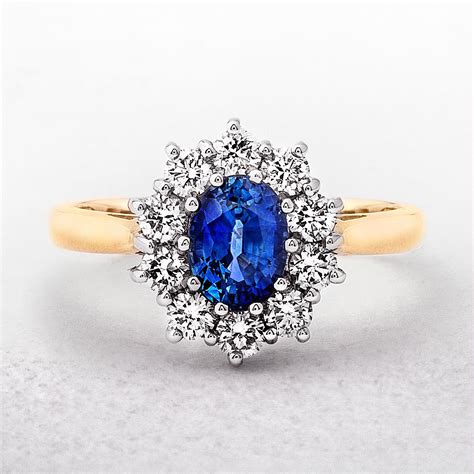 Yellow Gold Oval Sapphire & Diamond Cluster Ring | Halo diamond engagement ring, Diamond cluster ...