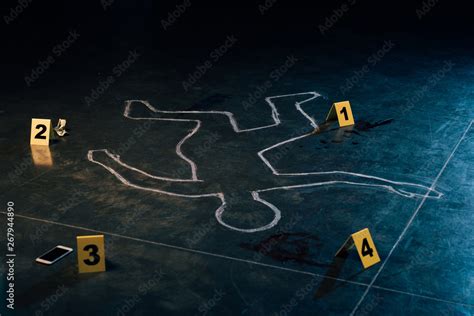 chalk outline and evidence markers at crime scene Stock Photo | Adobe Stock