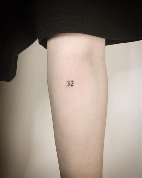 Tiny number 32 tattoo by Kirk Budden inked on the left forearm Dainty Tattoos, Mini Tattoos ...