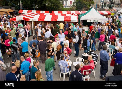 Crowded outdoor food stall area at Abergavenny Food Festival ...