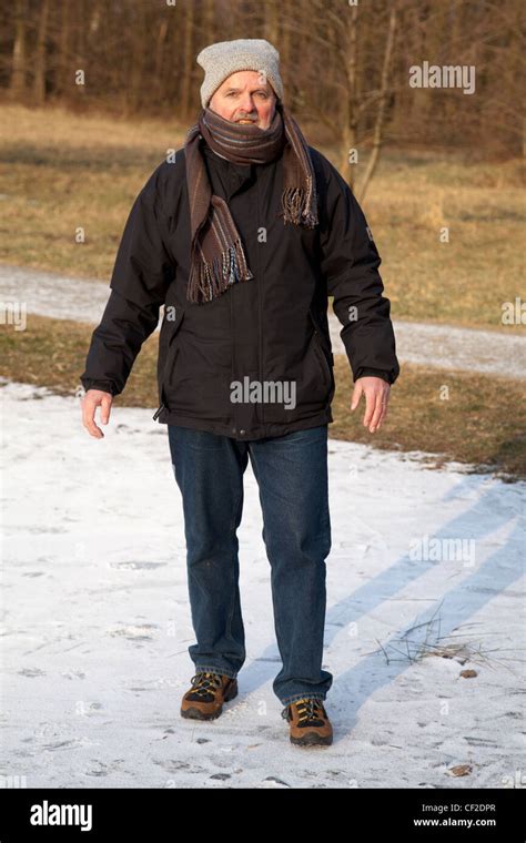 Elderly man is walking Stock Photo - Alamy