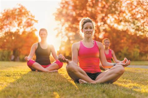 group of 3 women doing yoga in nature - Greystone Village